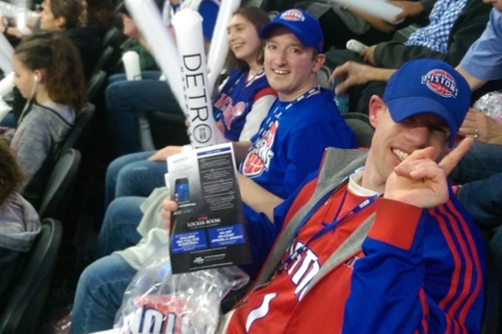 Lutz students seated in the stands at the Palace wearing Pistons gear enjoying the game.